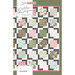 Pattern cover featuring a quilt design with floral and checkered squares in various colors