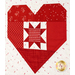 A super close up on one of the red pieced hearts, showing print details on the heart and sawtooth star.