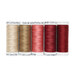 Five spools of thread in beige, pink and red arranged horizontally.