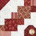 A close-up of a red and white quilt featuring various floral and geometric patterns.