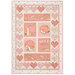 A pink children's quilt featuring bunnies and hearts isolated on a white background