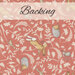 A swatch of coral pink fabric with sprawling leaves amongst hares, hedgehogs, and birds. A light banner at the top reads 