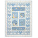 A blue children's quilt featuring bunnies and hearts isolated on a white background