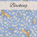 A swatch of sky blue fabric with sprawling leaves amongst hares, hedgehogs, and birds. A light banner at the top reads 