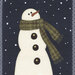 A cheerful snowman with a carrot nose and a green scarf stands against a dark background with falling snow.