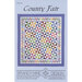 Cover design for a quilt pattern titled County Fair, featuring a colorful geometric design.