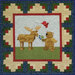 A quilt featuring a moose, a bear holding blueberries, and a red bird in a colorful patchwork border.