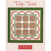 Quilt design titled Tulip Twirl, featuring a floral pattern in red and green on a polka dot background.