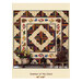 Quilt titled Summer at the Cabin features a log cabin design with floral and animal motifs.