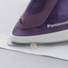 A purple Panasonic iron ironing under a button, showcasing a precision tip to reach narrow places