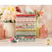 A Stack of the fabrics included in the La Fleur Flannel collection, with vases and flowers and thread.