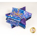 A stack of the fabric included in the Bali Batiks Wisteria Blooms FQ set, tied with twine with a label.