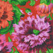 Vibrant floral pattern featuring pink and orange flowers against a bright orange background