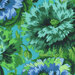 Floral pattern featuring large, vibrant blue and green flowers on a turquoise fabric