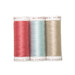 Three spools of thread in pink, blue, and ecru, isolated on a white background.