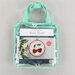 A clear, mint green carrying bag containing a cherry-themed embroidery kit by KimberBell.