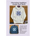 Lavender front cover of the Charming Applique Double Aster Block Pattern, showing a completed example of the sweatshirt project.