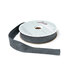 A spool of graphite ribbon with a portion unspoiled isolated on a white background.