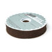 Spool of chocolate brown bias tape isolated on a white background