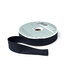 A spool of soft black ribbon with a portion unspoiled isolated on a white background.