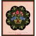 A decorative wool penny mat featuring blue birds, pink flowers, and green leaves in a floral bowl design.