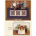 An oak leaf table runner and a turkey tea towel displayed with a candle and dried flowers.