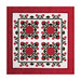 Quilt design featuring four floral motifs in red and green, framed on a white background with a red border.