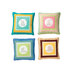 Four decorative throw pillows featuring colorful patterned borders and embroidered cartoon designs.