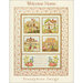 A quilt design featuring four embroidered houses with floral details and the text Welcome Home.