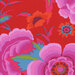 Vibrant red fabric pattern featuring large pink, purple, and orange flowers with green leaves.