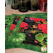 Three decorative placemats featuring vibrant red flowers, green leaves, and a dragonfly on a black background.