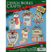 Package of a plastic canvas ornament kit featuring six holiday designs, including a snowman, gifts, and decorative text.