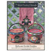 Front cover of the pattern, showing two completed Halloween-themed appliqué buckets and one witch-themed appliqué wrap staged outdoors.