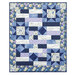 A colorful quilt featuring floral patterns and inspirational text panels in purple and blue tones isolated on a white background