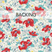 A swatch of cream fabric with white and red florals. A red banner at the top reads 