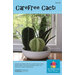 Cover of a pattern booklet featuring three faux cacti in a white bowl on a windowsill.