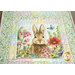 A quilted table runner featuring a rabbit surrounded by colorful flowers and a butterfly.