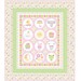 The completed quilt for the Bundle of Joy Panel Quilt, colored in yellow, green and pink baby fabrics and isolated on a white background.