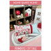 Front cover of the pattern showing the completed project as a pillow, staged with pink, red, and white heart themed decor.