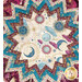 Close up of the middle of the table topper featuring celestial motifs like suns, moons, and stars in a starburst design.