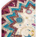 Up close of table topper featuring a zigzag pattern with celestial motifs, stars, and sun designs in cream purple and teal colors