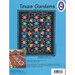 A colorful quilt pattern titled Texas Gardens featuring floral and star designs on a black background.