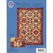 A quilt pattern titled Bed of Roses featuring geometric designs in red, blue, and cream colors, with inset pillowcase.