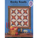 Cover of a quilt pattern titled Rocky Roads, featuring a geometric star design and colorful fabrics.