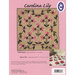 Design guide for the Carolina Lily quilt featuring floral patterns on a pink background.