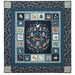 The completed Twilight Creatures quilt, colored in navy and soft blues and featuring adorable stylized portraits of sleepy and nocturnal animals, isolated on a white background.