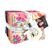 A bundle of colorful fabrics wrapped together with a measuring tape ribbon.