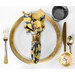 A top down shot of a place setting with the reversible black honey jar fabric of the napkin faced out.