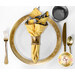 A top down shot of a place setting with the reversible yellow honeycomb fabric of the napkin faced out.