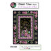 Quilt pattern design featuring floral motifs on a black background with decorative borders.